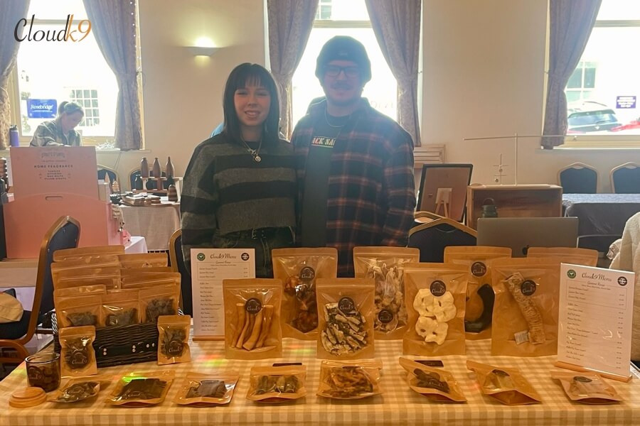 James and Ella at a Cloud K9 market stall with their range of natural dog treats and chews